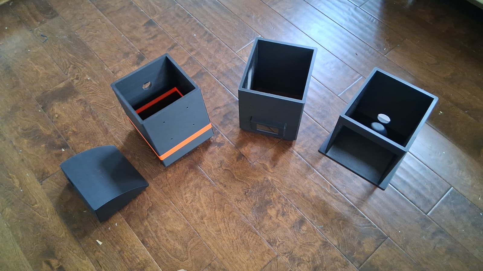 Four printed kiosk sections laid out separately before assembly